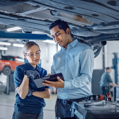 Two people talking in a factory